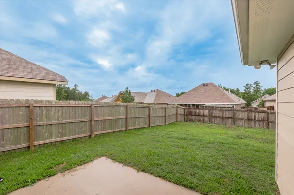 a view of a backyard with a garden and plants