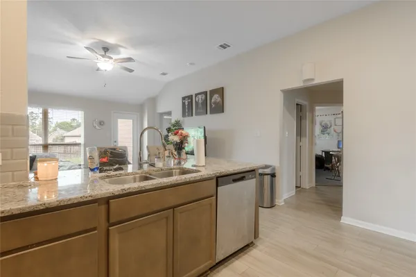 a kitchen with sink and cabinets