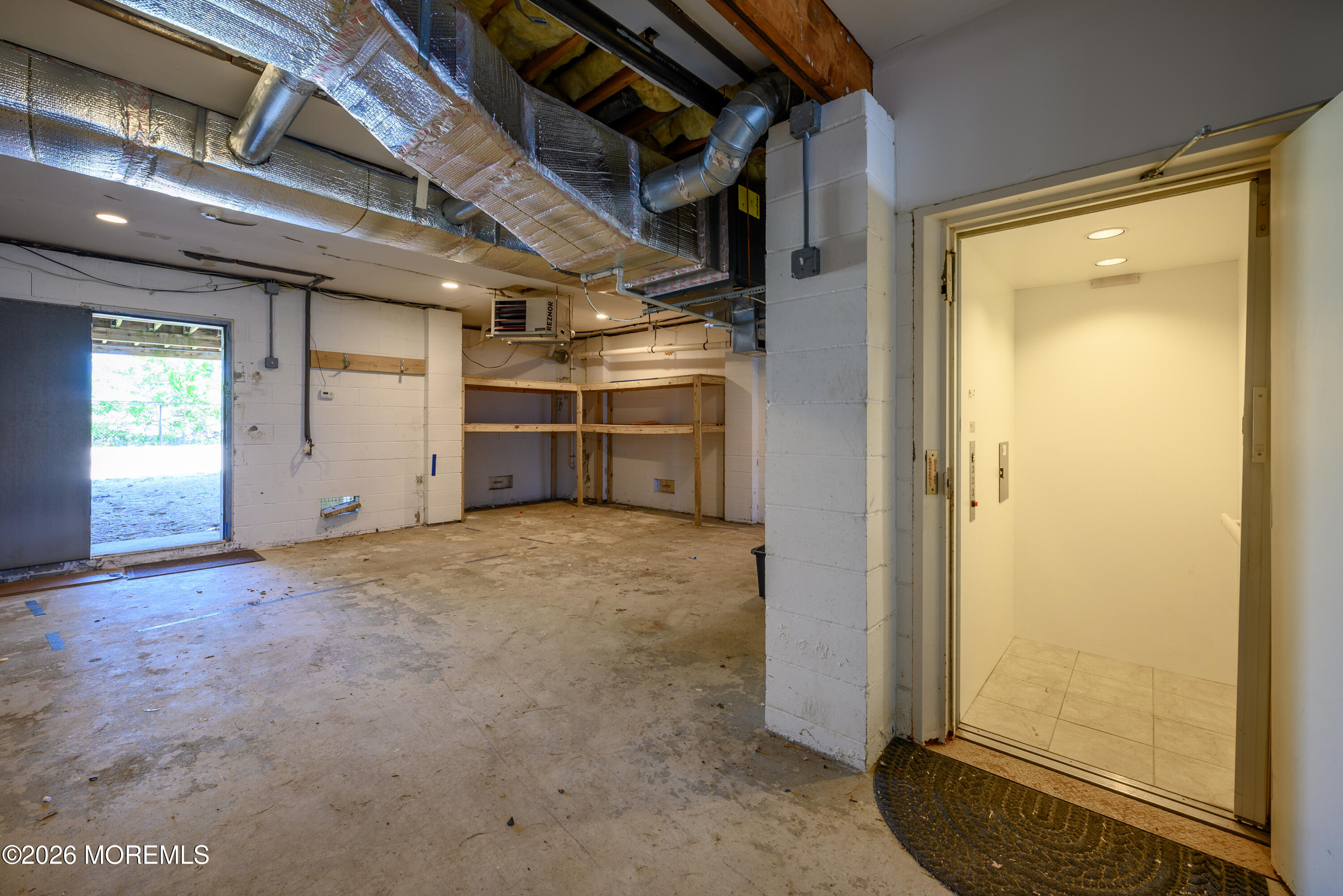 805 Front Street Union Beach, NJ 07735 - Photo 50 of 65 Elevator/Basement Exit to Back