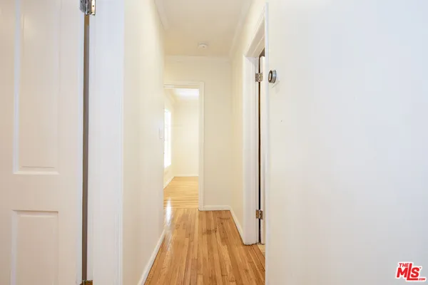 a bathroom with a tub sink shower and a mirror
