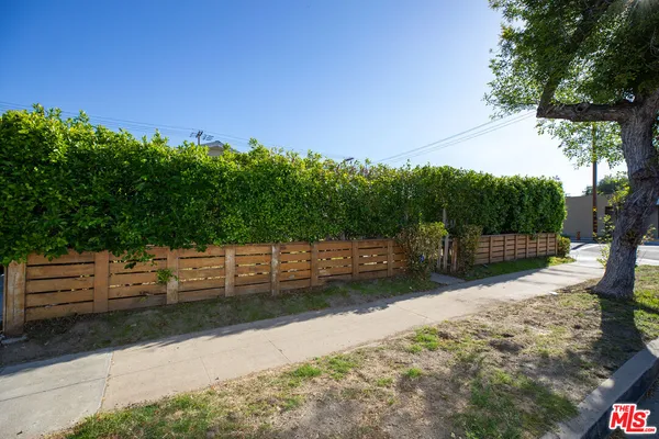 a view of a backyard of the house