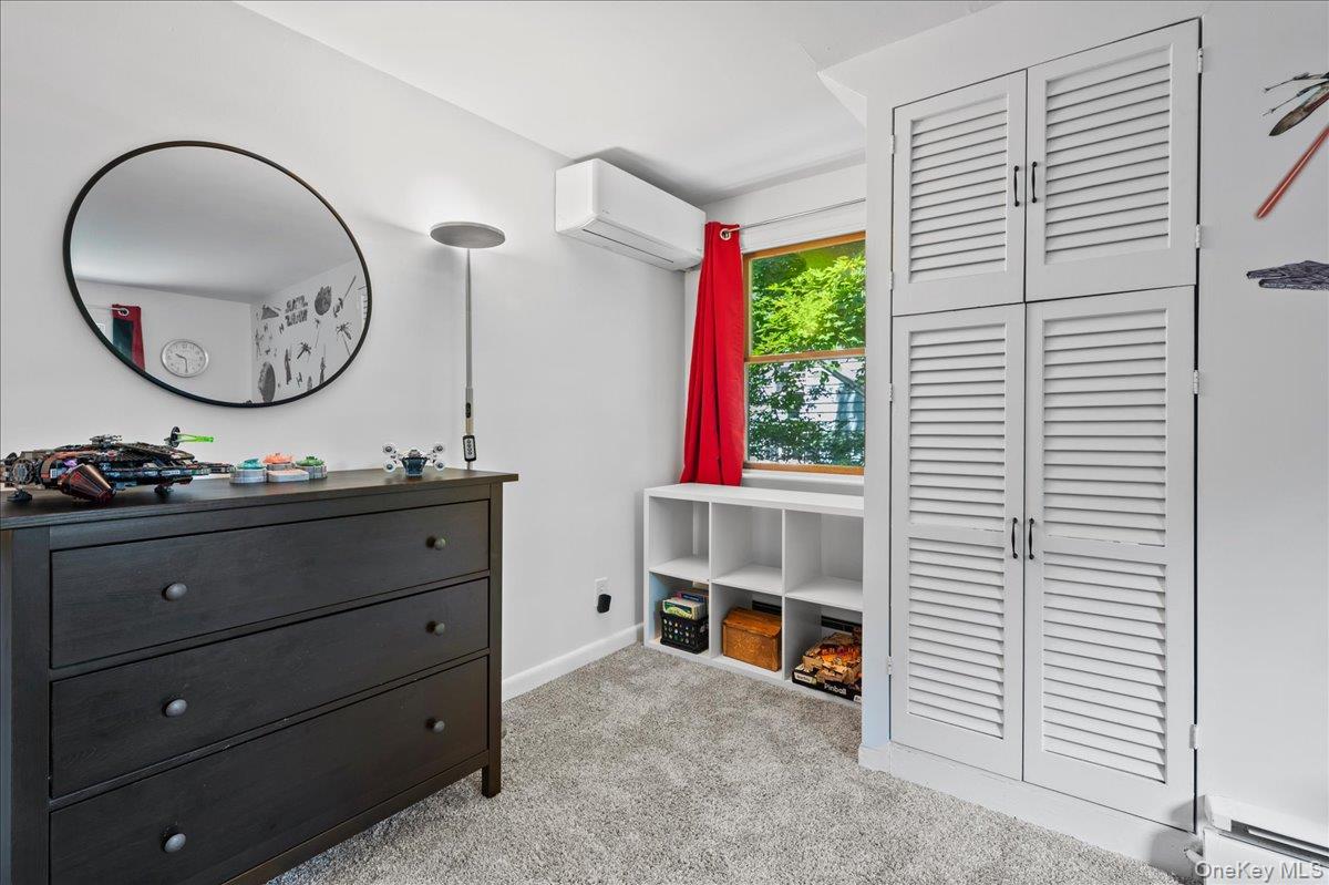 105 High St Extension Mount Kisco, NY 10549 - Photo 28 of 38 a living room with furniture and a window