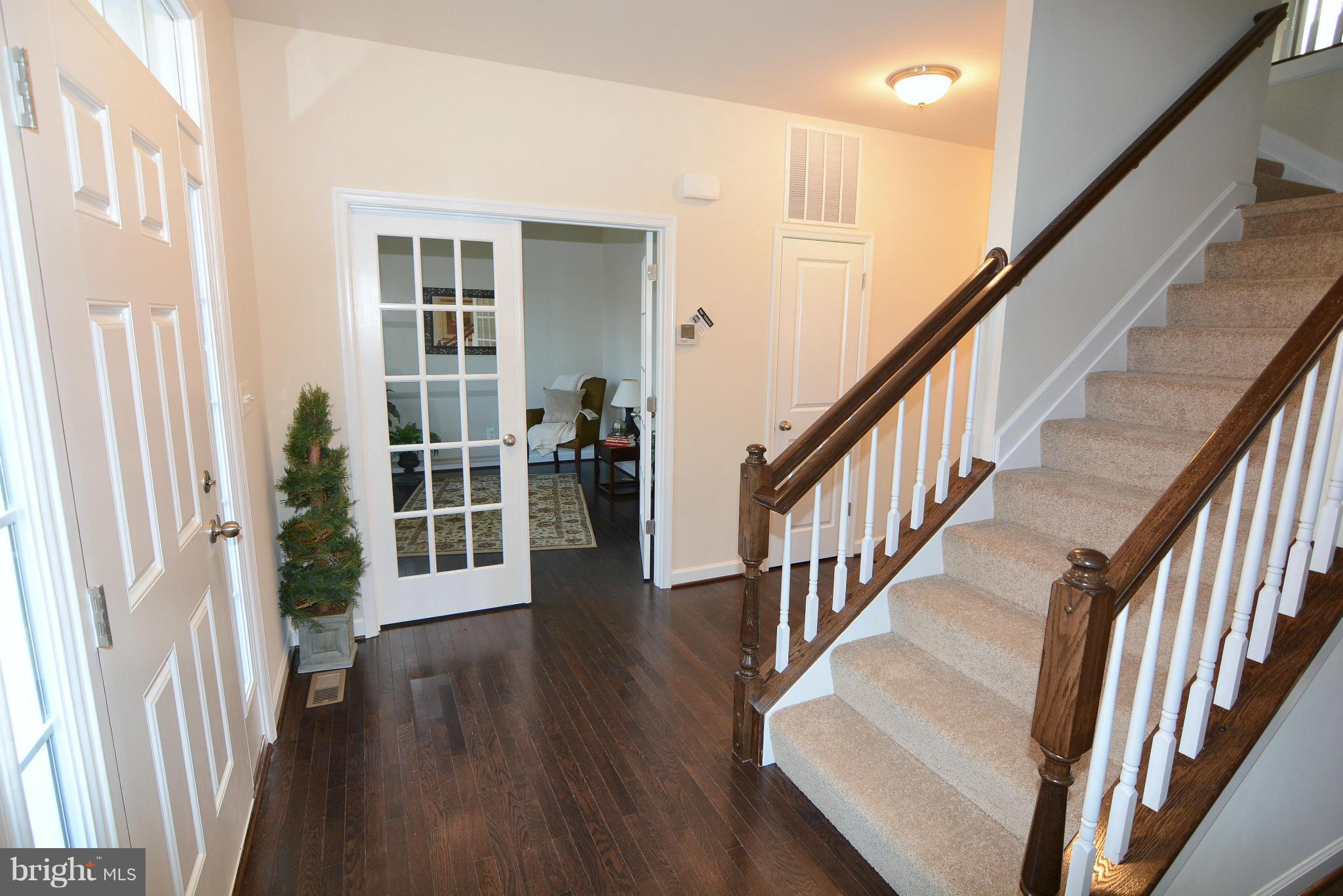 1217 Shesley Road Mayo, MD 21037 - Photo 2 of 30 a view of an entryway with wooden floor and stairs