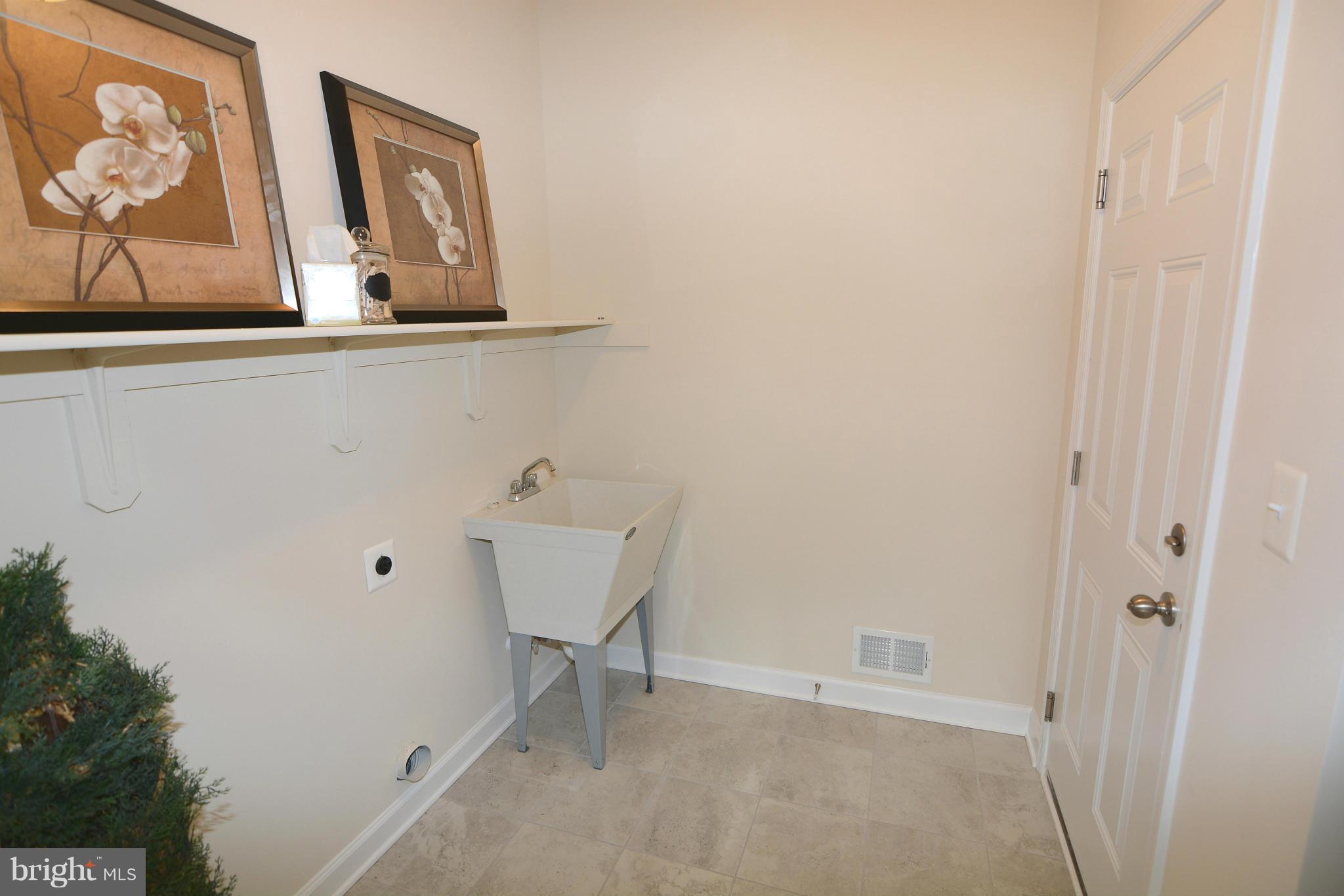 1217 Shesley Road Mayo, MD 21037 - Photo 25 of 30 a view of a hallway with paintings on the wall