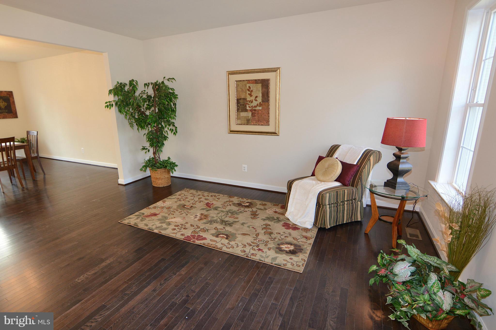 1217 Shesley Road Mayo, MD 21037 - Photo 4 of 30 a room with wooden floor and a potted plant