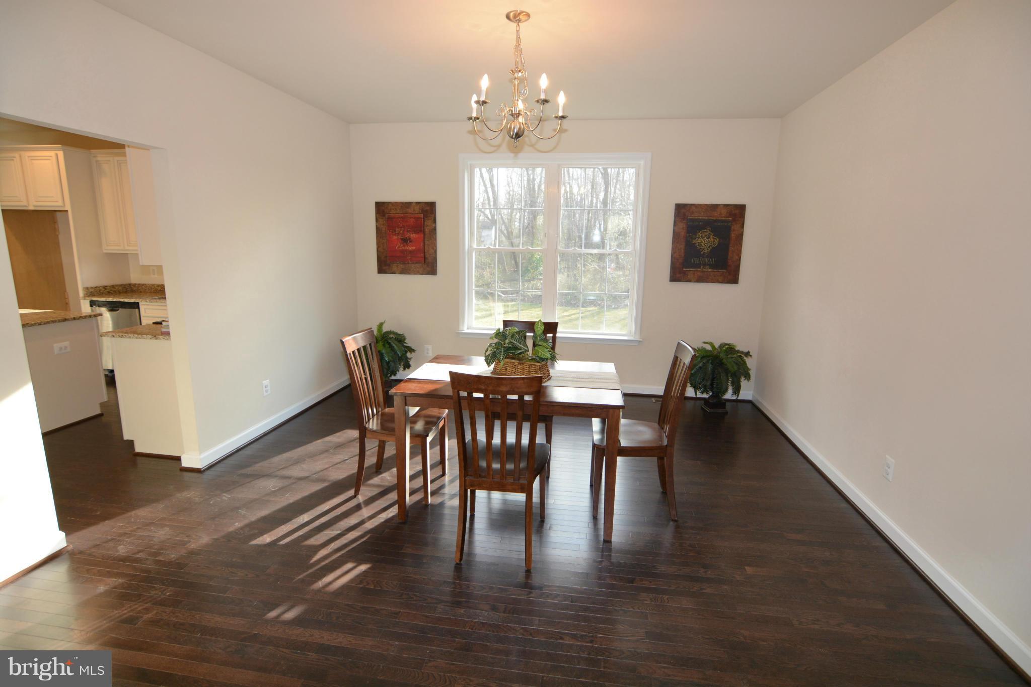 1217 Shesley Road Mayo, MD 21037 - Photo 5 of 30 a view of a dining room with furniture window and wooden floor