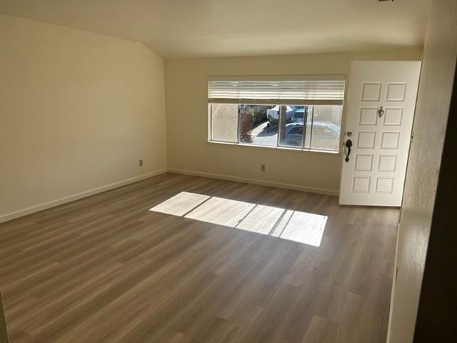 4479 Ranchero Drive Soquel, CA 95073 - Photo 3 of 11 wooden floor in an empty room with a window