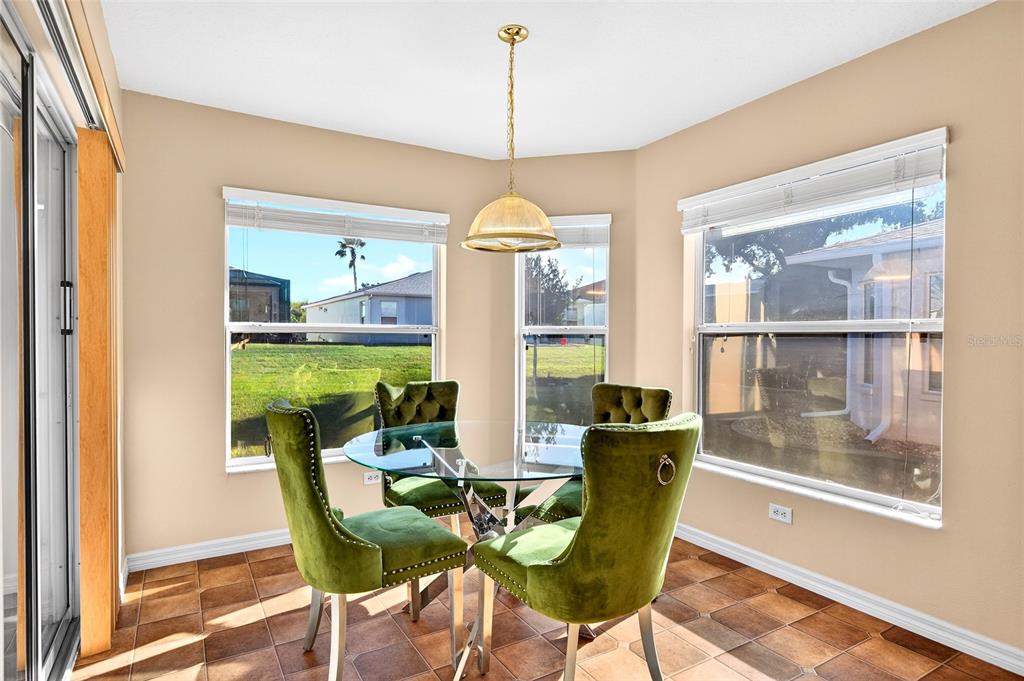 1706 Southwest 156th Lane Ocala, FL 34473 - Photo 13 of 44 a view of a dining room with furniture and a window