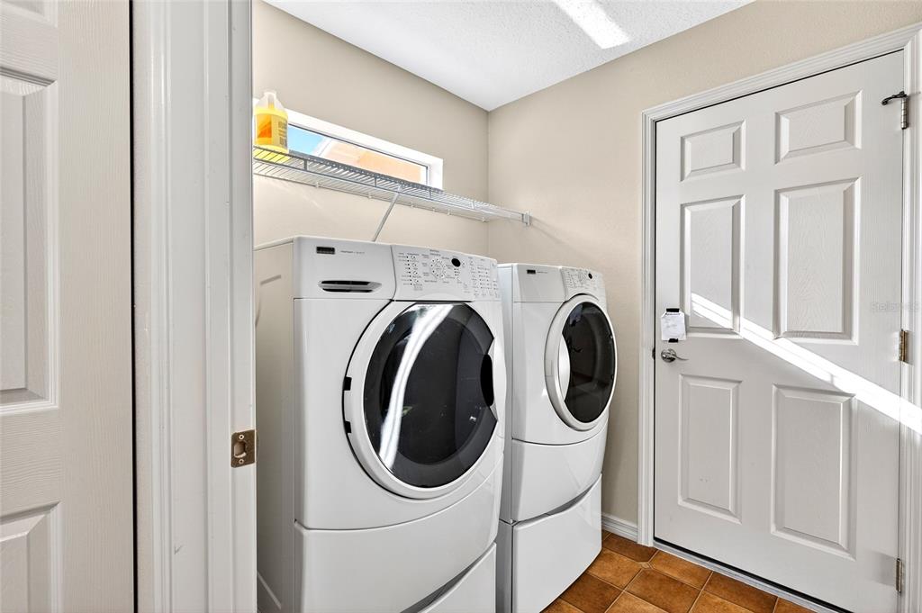 1706 Southwest 156th Lane Ocala, FL 34473 - Photo 15 of 44 a utility room with dryer and washer