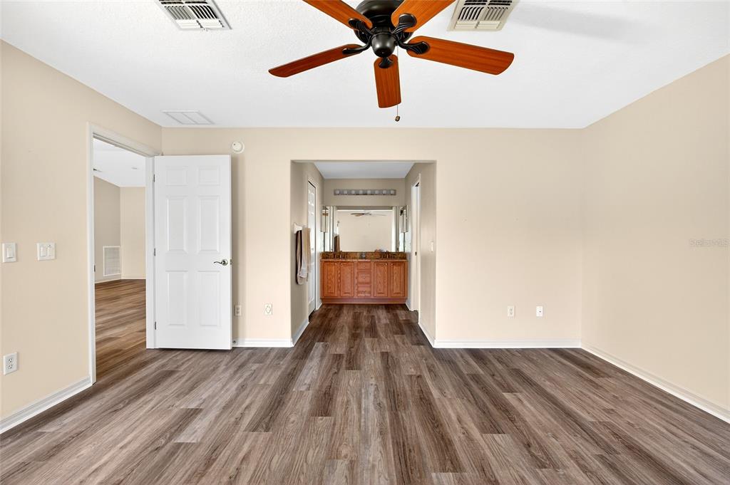 1706 Southwest 156th Lane Ocala, FL 34473 - Photo 19 of 44 wooden floor in an empty room with a window