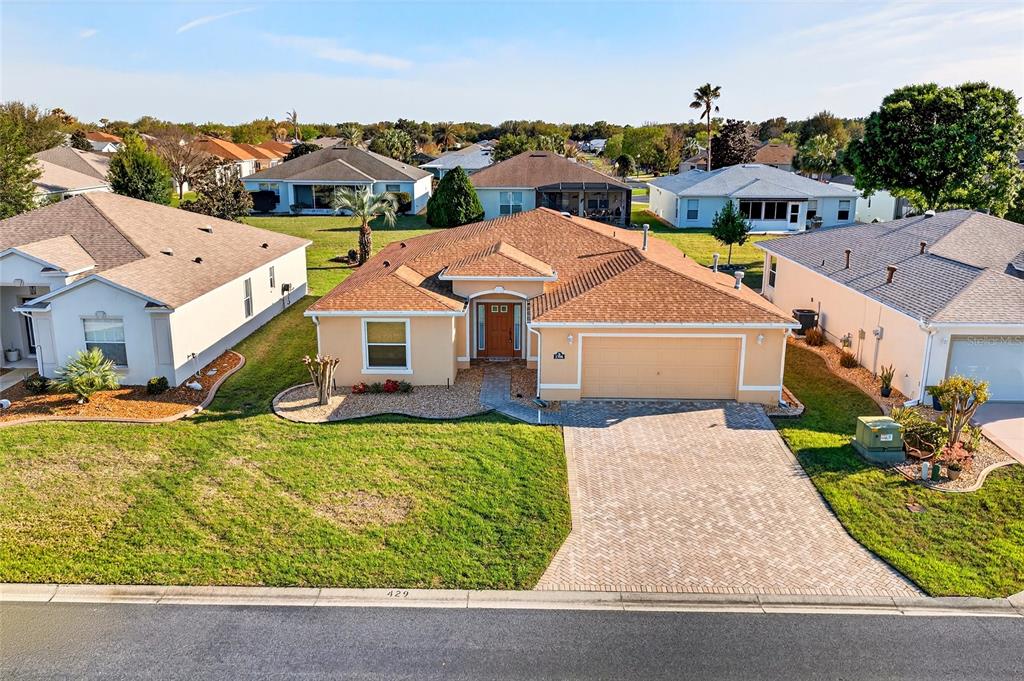 1706 Southwest 156th Lane Ocala, FL 34473 - Photo 2 of 44 an aerial view of a house with a yard