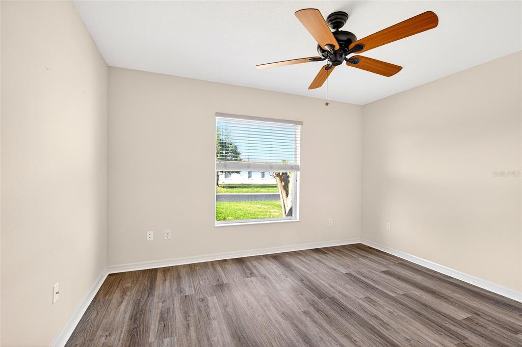 1706 Southwest 156th Lane Ocala, FL 34473 - Photo 21 of 44 an empty room with a window and a ceiling fan