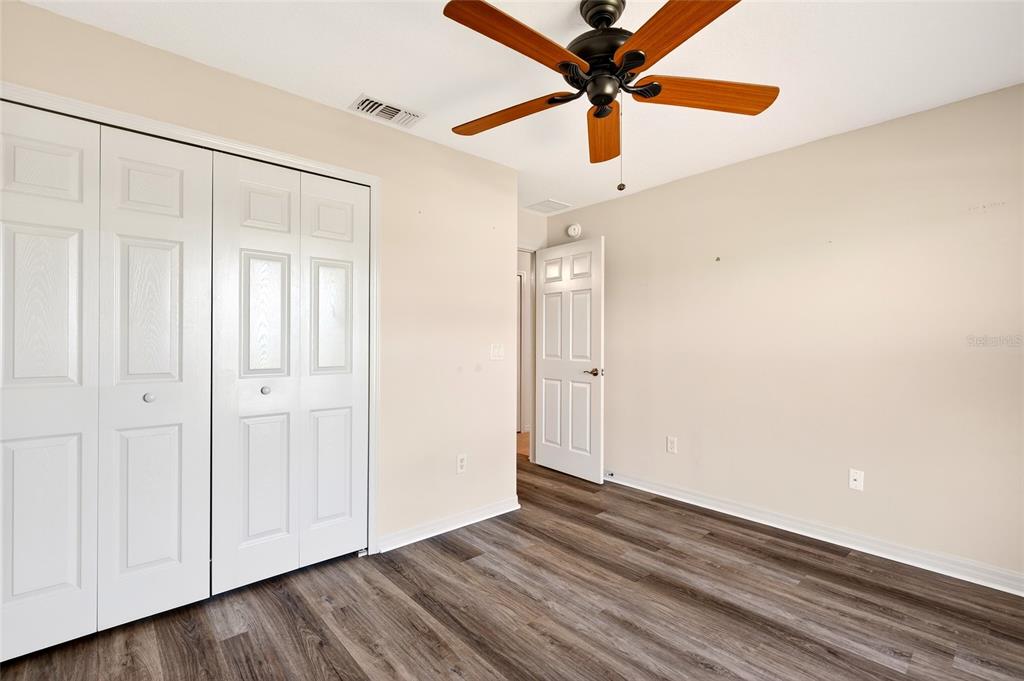 1706 Southwest 156th Lane Ocala, FL 34473 - Photo 23 of 44 a view of an empty room with wooden floor