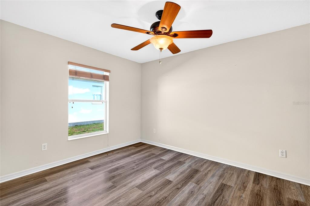 1706 Southwest 156th Lane Ocala, FL 34473 - Photo 25 of 44 wooden floor in an empty room with a window