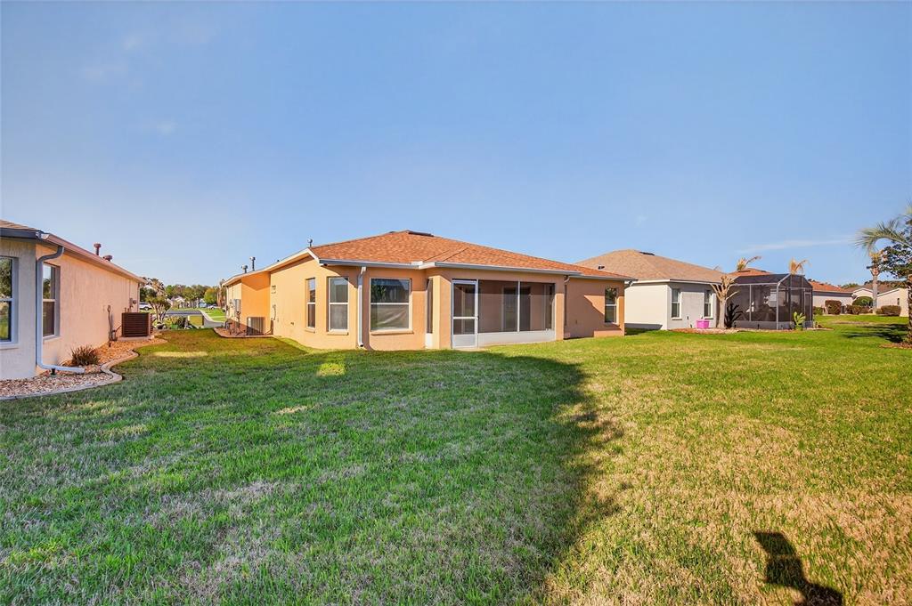 1706 Southwest 156th Lane Ocala, FL 34473 - Photo 31 of 44 a front view of a house with a yard