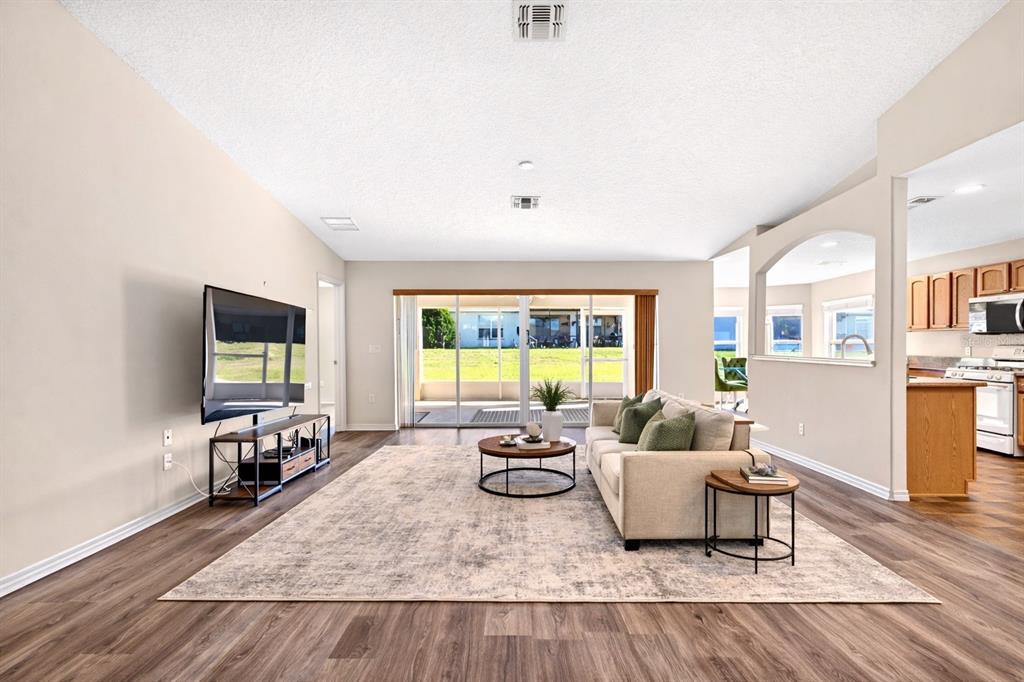 1706 Southwest 156th Lane Ocala, FL 34473 - Photo 5 of 44 a living room with furniture and a flat screen tv