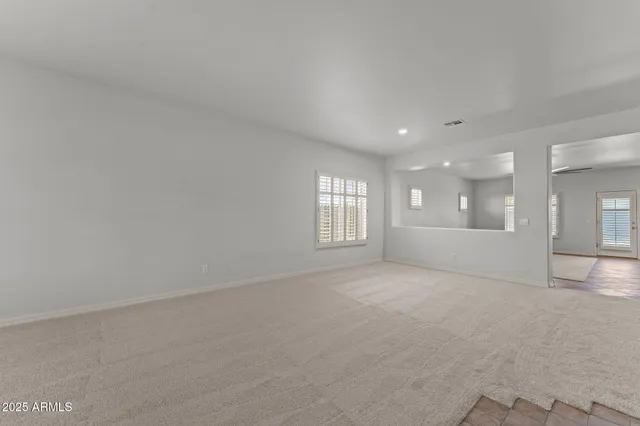 a view of an empty room and a windows