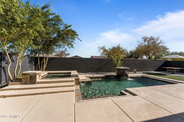 a view of swimming pool with a yard