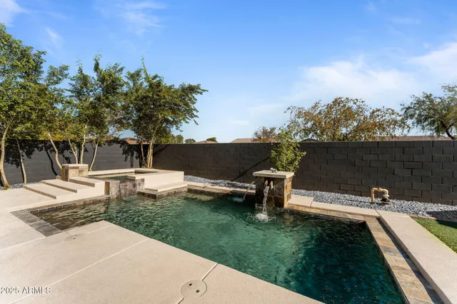 a front view of house with a garden