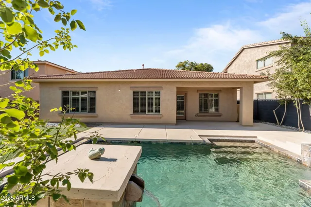 a view of a backyard with sitting area