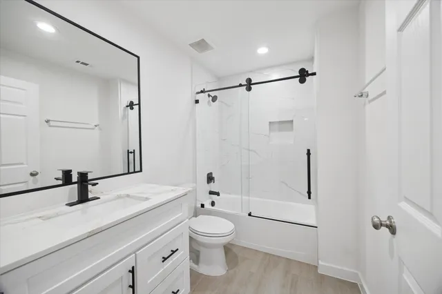 a bathroom with a double vanity sink and mirror