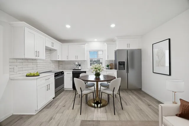 a view of kitchen with wooden floor and window