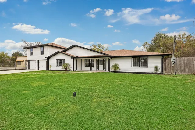 a view of a house with a big yard