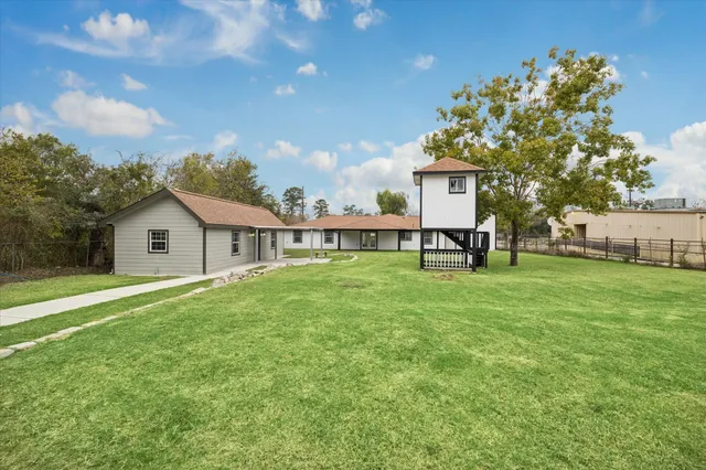an aerial view of a house with garden space lake view and mountain view in back