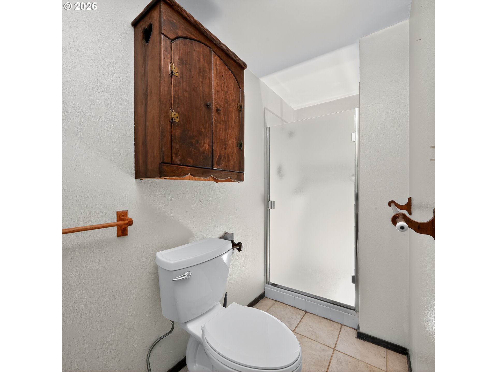 840 South 1st Street Cottage Grove, OR 97424 - Photo 22 of 39 a white toilet sitting next to a bathroom sink