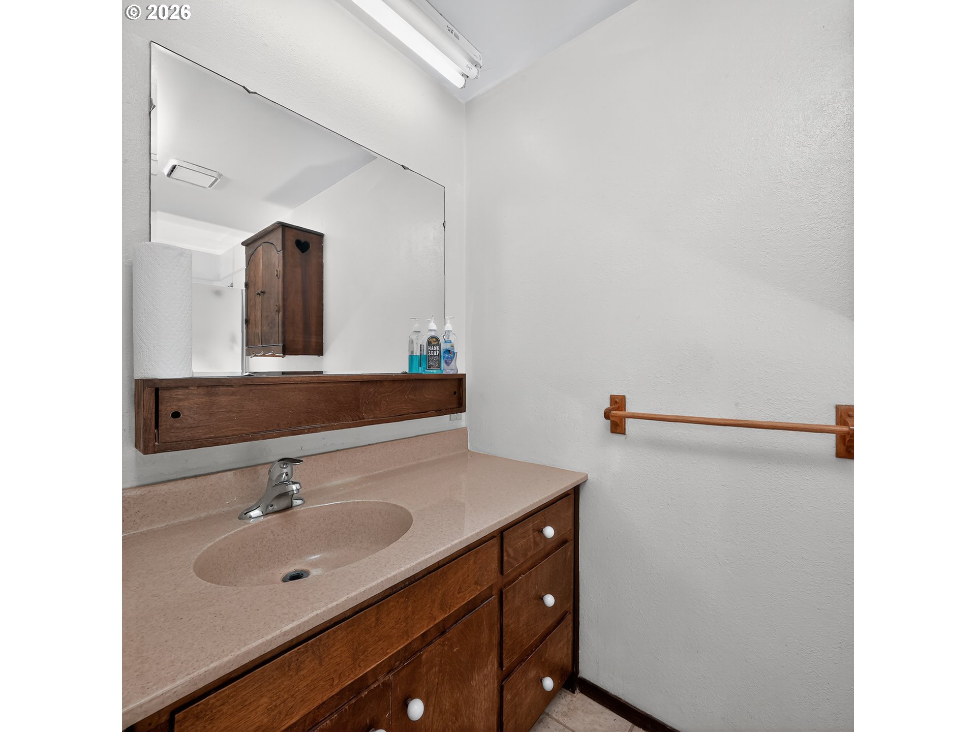 840 South 1st Street Cottage Grove, OR 97424 - Photo 23 of 39 a bathroom with a sink and a mirror