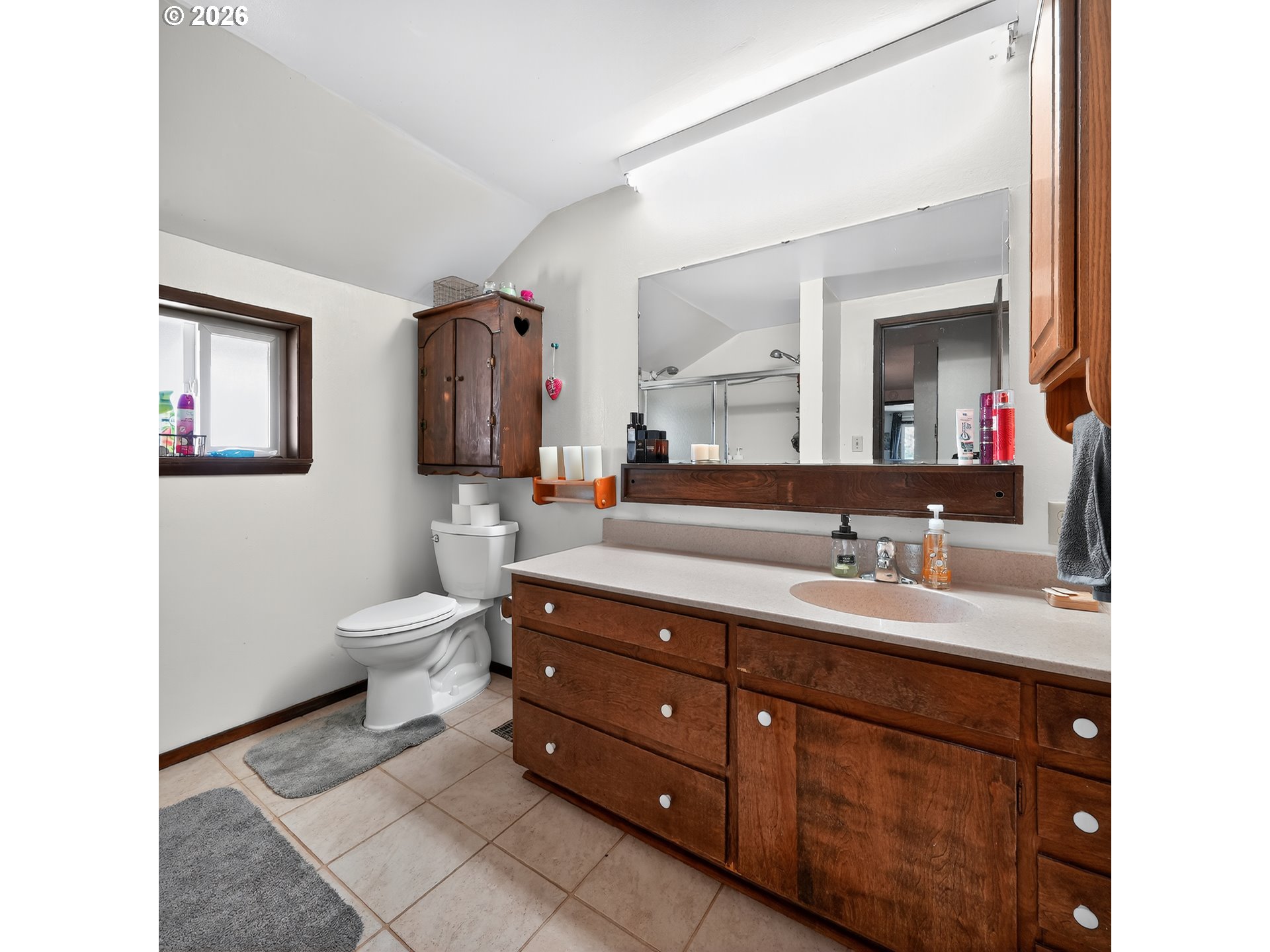 840 South 1st Street Cottage Grove, OR 97424 - Photo 27 of 39 a bathroom with a toilet sink and mirror