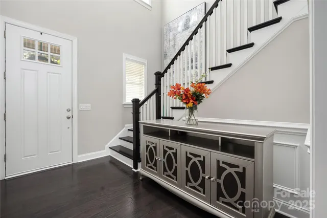 a view of an entryway with wooden floor