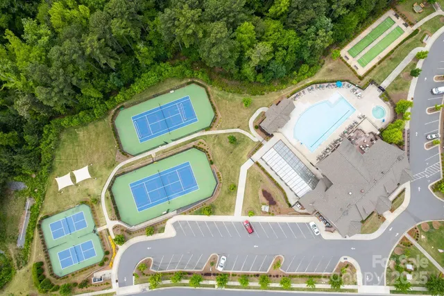 an aerial view of a house with a swimming pool