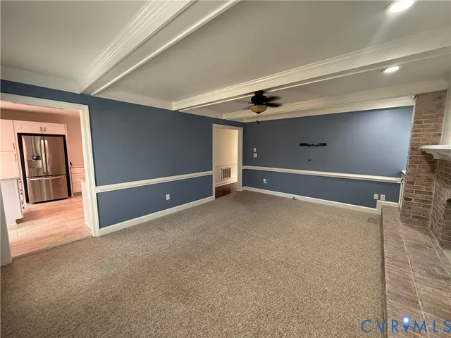 a view of a lake with houses in the back