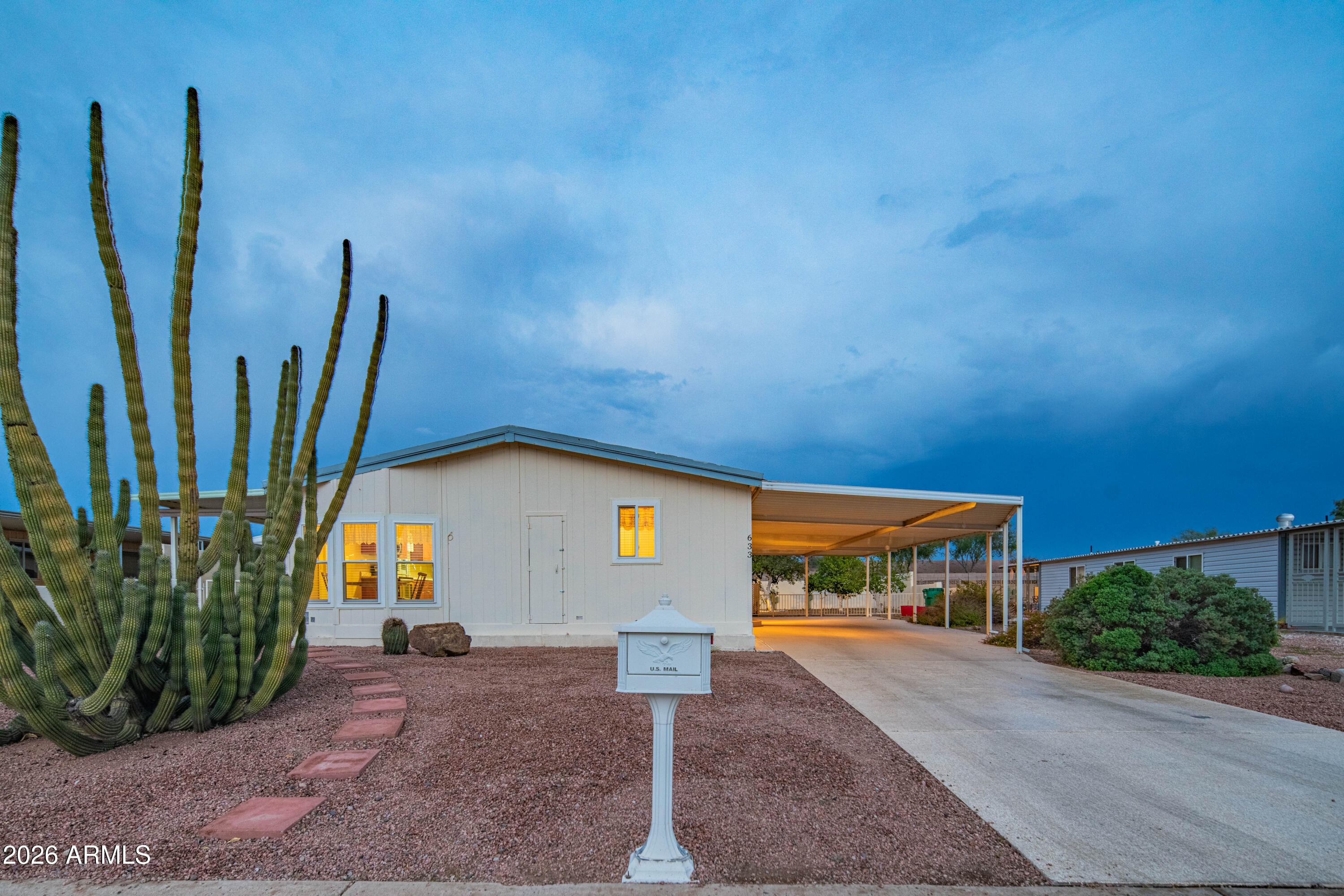 633 South 87th Place Mesa, AZ 85208 - Photo 2 of 55 a front view of a house with a yard