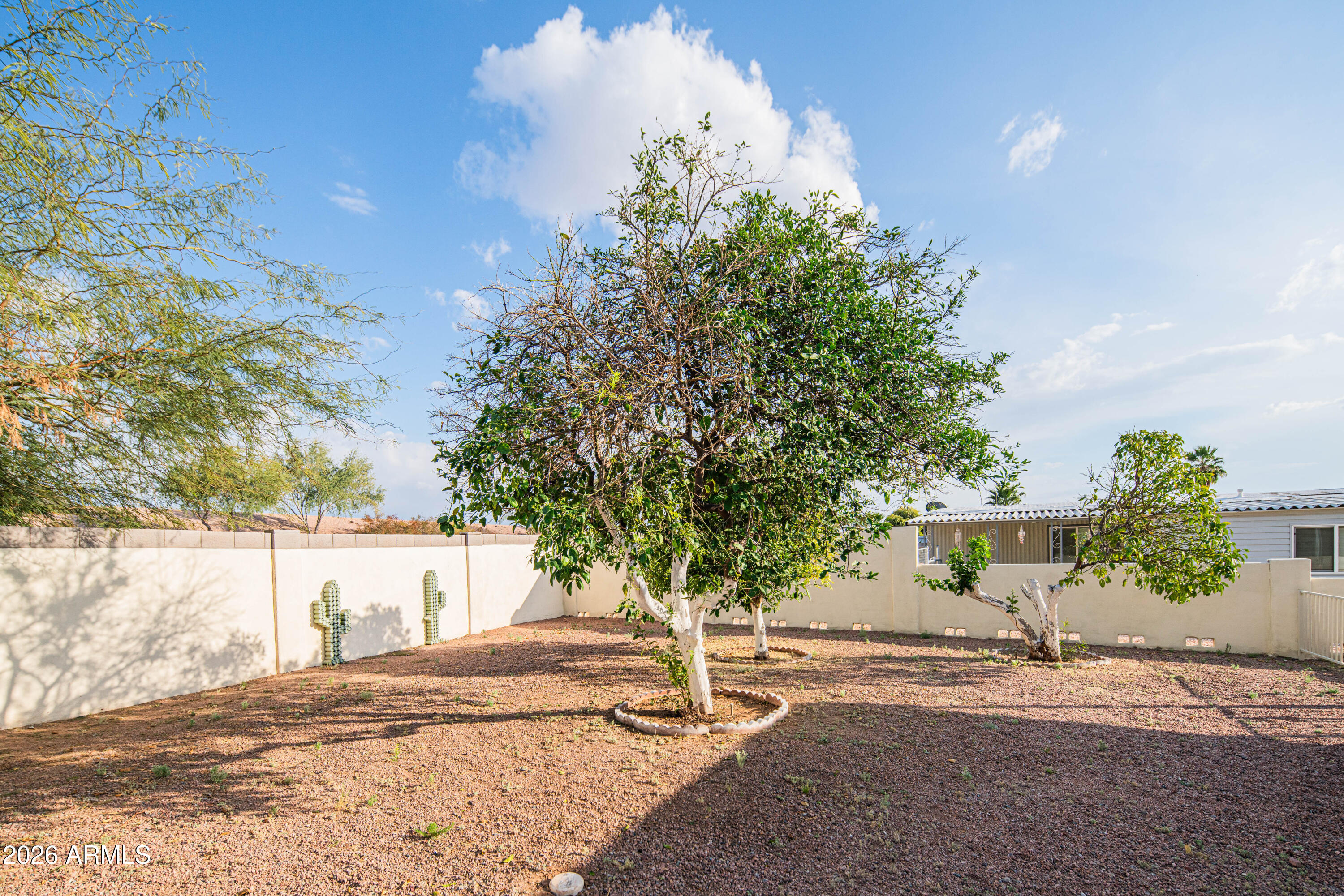 633 South 87th Place Mesa, AZ 85208 - Photo 21 of 55 a view of a tree in front of a house