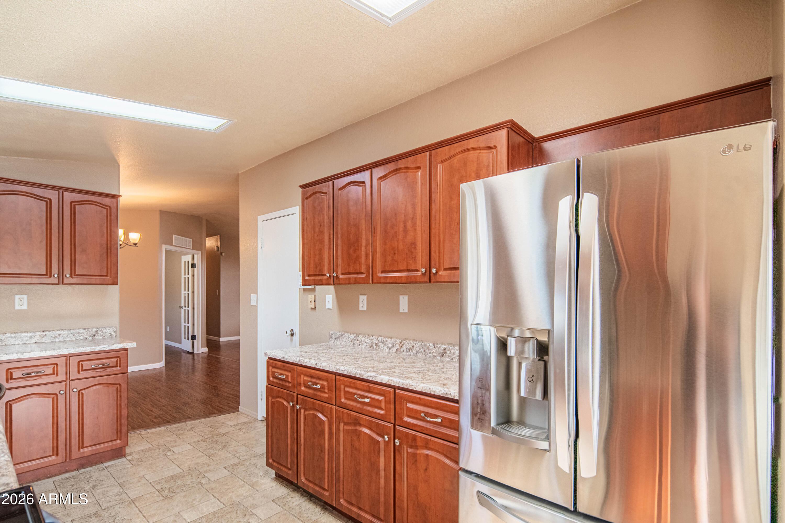 633 South 87th Place Mesa, AZ 85208 - Photo 33 of 55 a kitchen with stainless steel appliances granite countertop a refrigerator and a sink