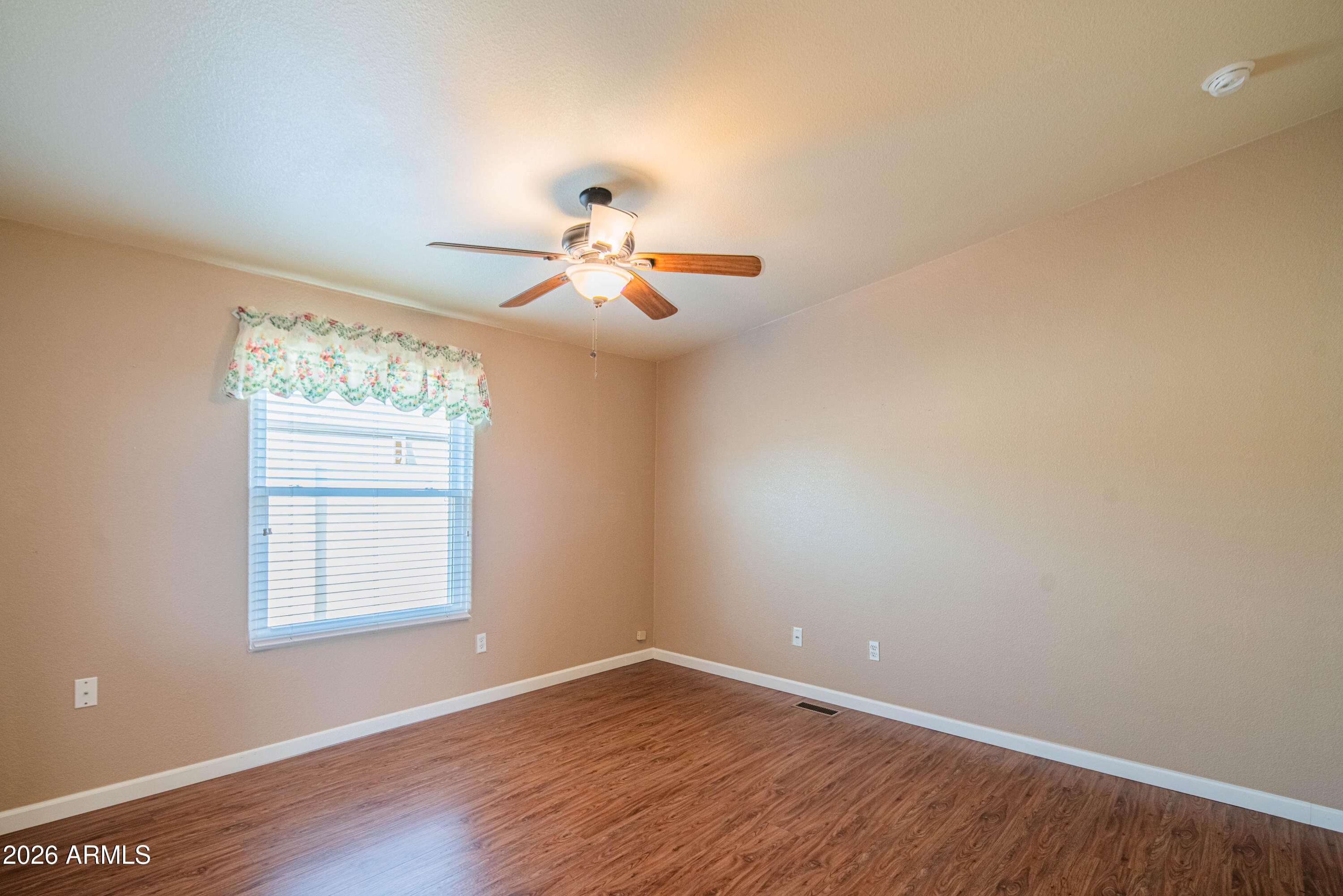 633 South 87th Place Mesa, AZ 85208 - Photo 44 of 55 wooden floor in an empty room with a window