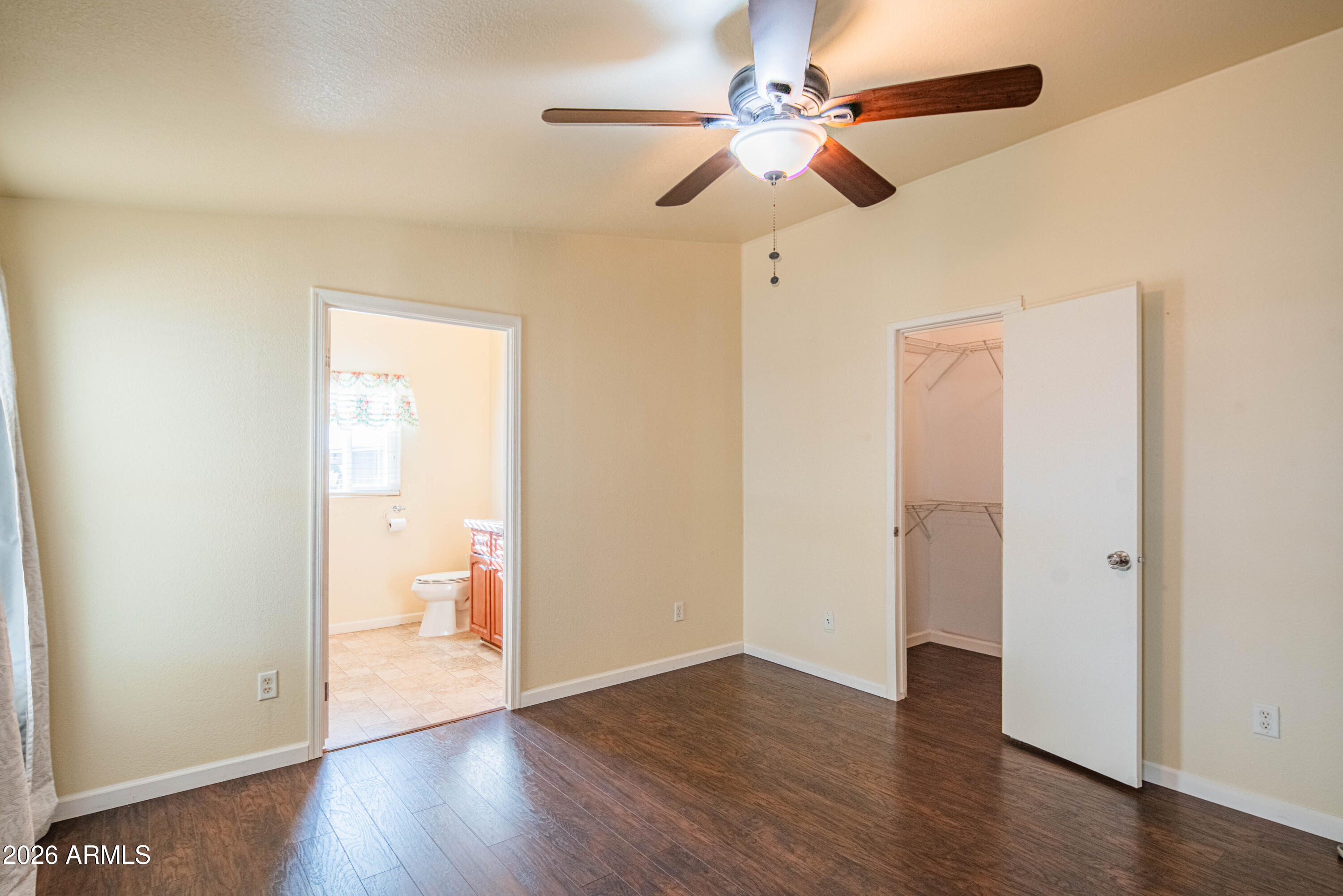 633 South 87th Place Mesa, AZ 85208 - Photo 47 of 55 a view of a room with wooden floor and a ceiling fan