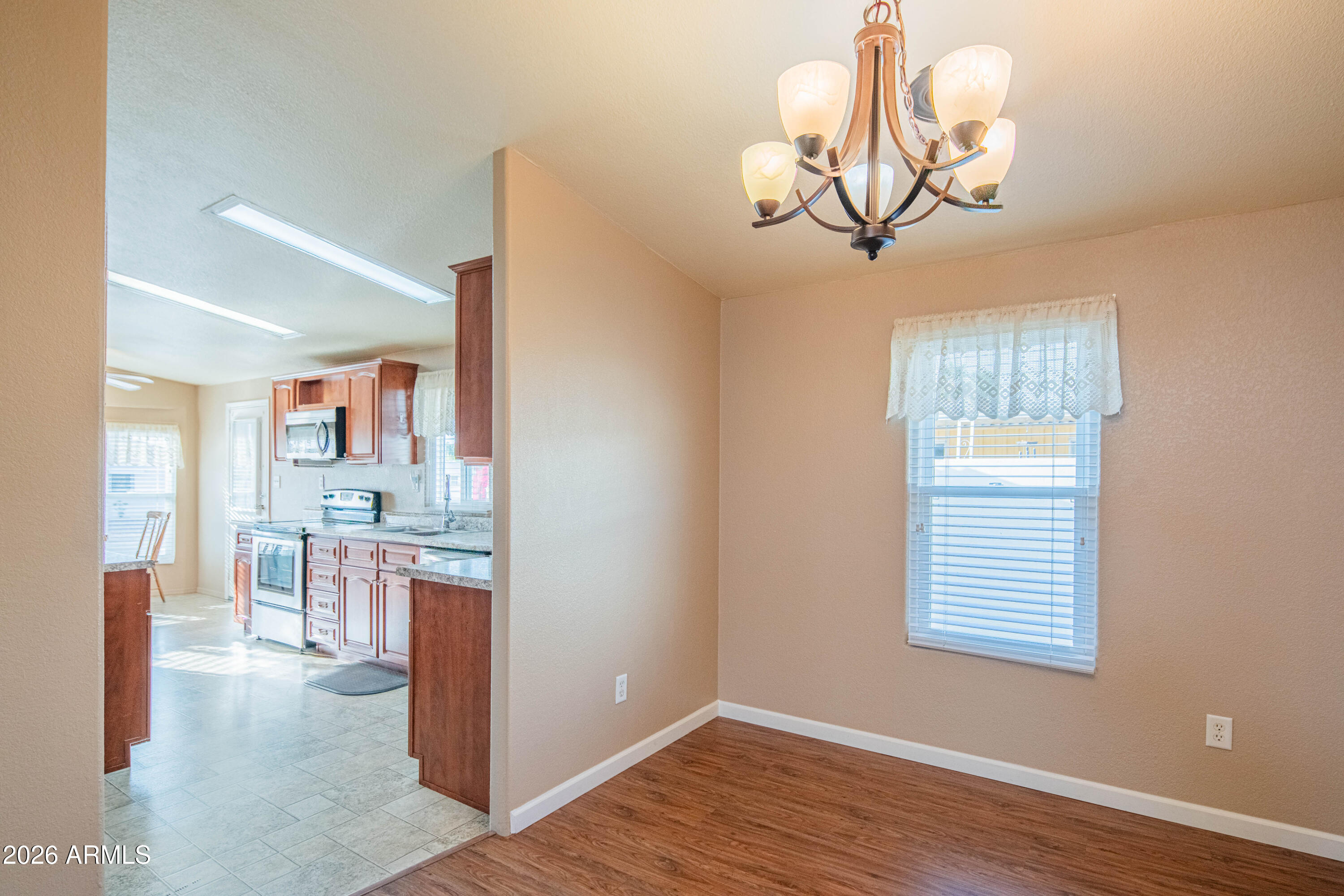 633 South 87th Place Mesa, AZ 85208 - Photo 51 of 55 a view of a room with a chandelier furniture and windows
