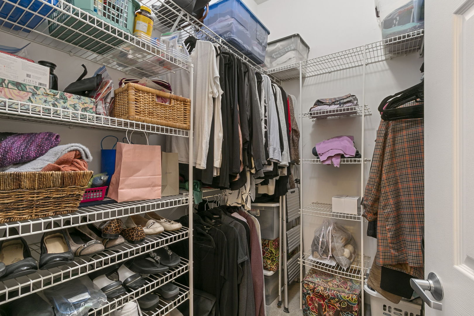1301 West Washington Boulevard, Unit 508 Chicago, IL 60607 - Photo 11 of 17 a view of walk in closet with clothes and shoes