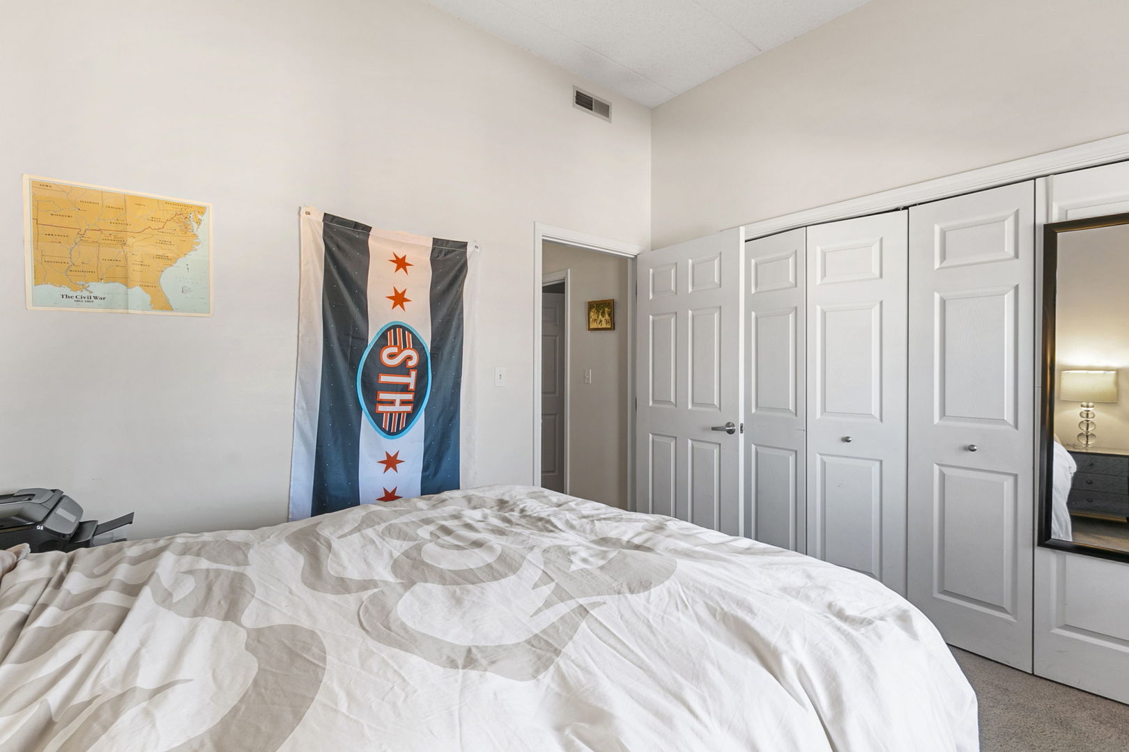 1301 West Washington Boulevard, Unit 508 Chicago, IL 60607 - Photo 15 of 17 a bedroom with a large bed and a closet