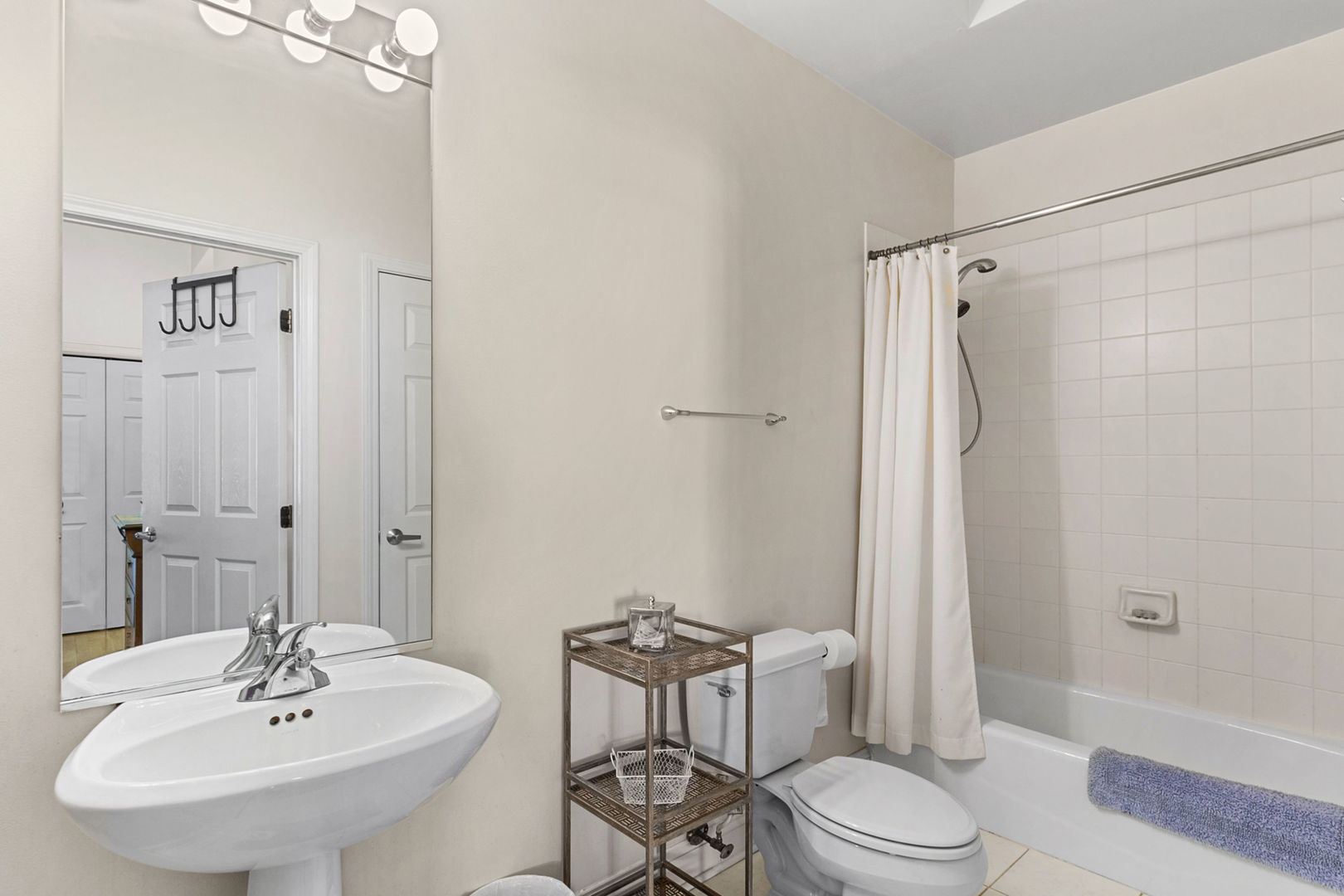 1301 West Washington Boulevard, Unit 508 Chicago, IL 60607 - Photo 16 of 17 a bathroom with a sink toilet and shower