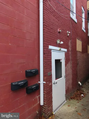 a backyard of a house with barbeque oven