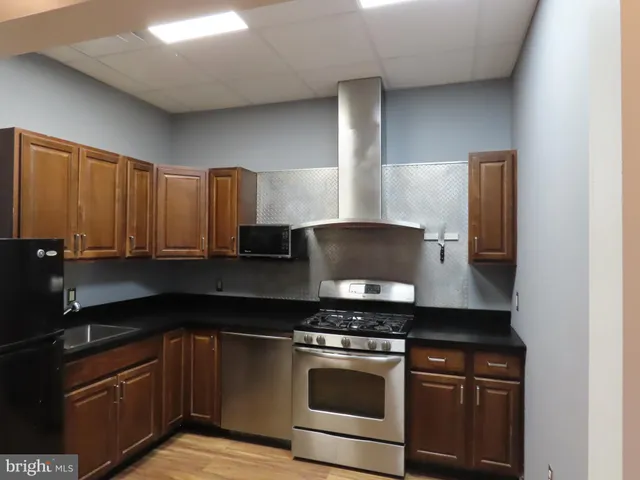 a kitchen with a stove and a sink