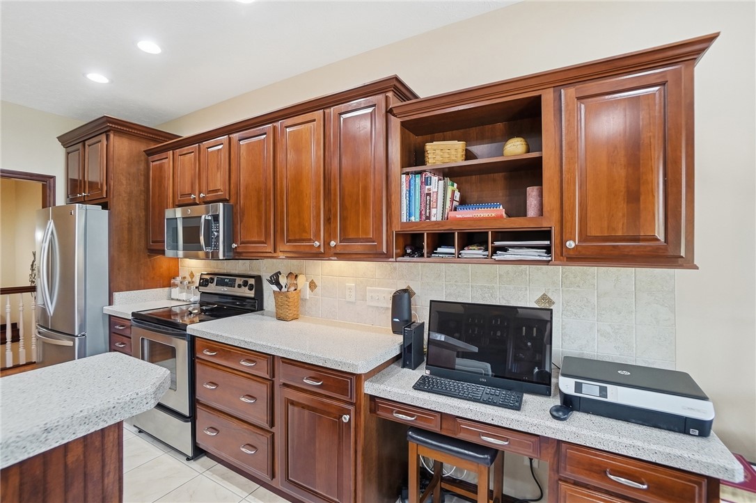 710 Governors Road Troy, OH 45373 - Photo 11 of 56 This spacious kitchen offers ample storage, bright lighting, and a functional workspace.
