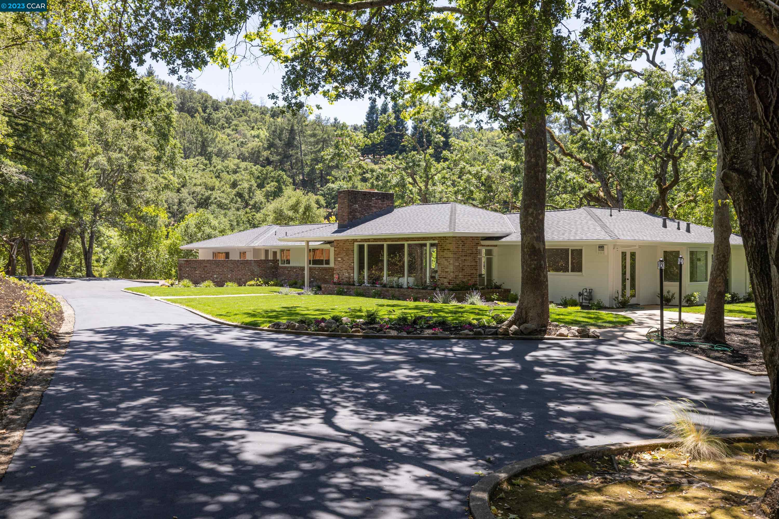 18 Sycamore Road Orinda, CA 94563 - Photo 1 of 1 a view of a house with backyard and sitting area