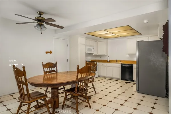 a kitchen with a table and chairs in it