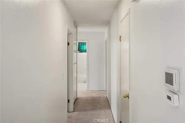 a view of a hallway with closet area