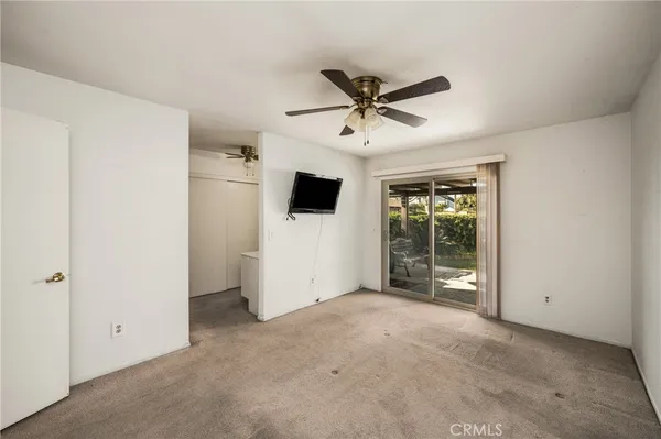 a view of a livingroom with a ceiling fan